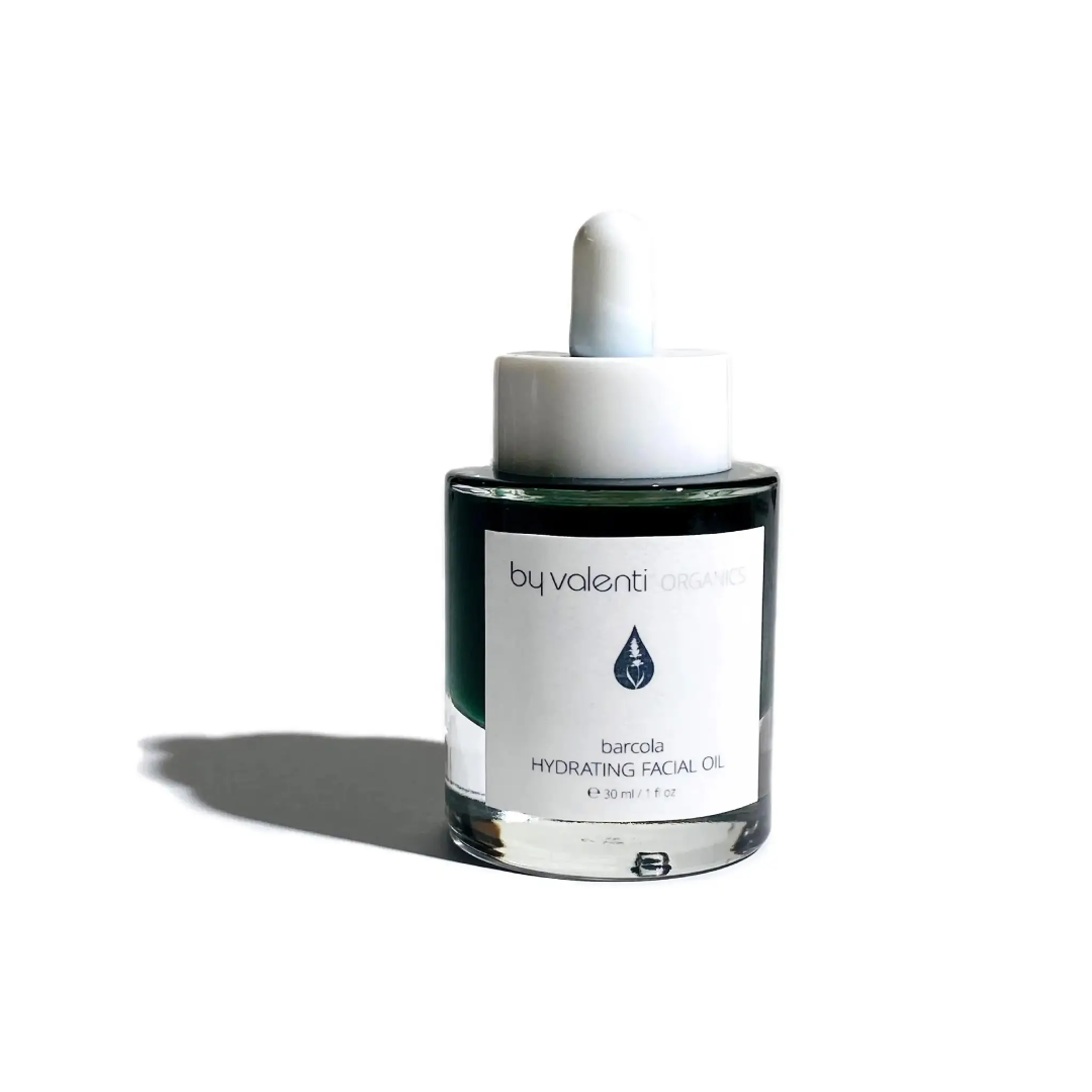By Valenti green blue hydrating serum 30 ml glass bottle over a white background