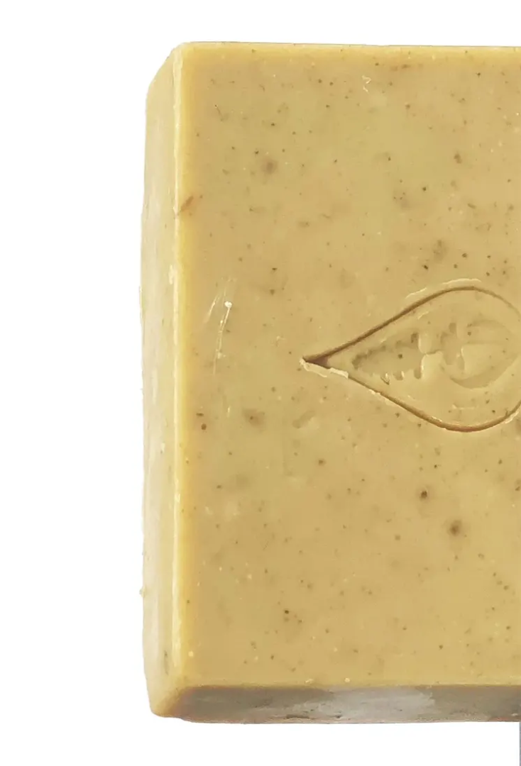 Close-up of a BY VALENTI Japanese Green Tea bar of soap with a logo on a white background